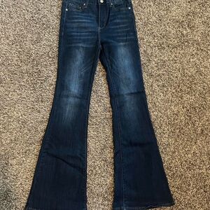 Dark wash flare lace up back jeans